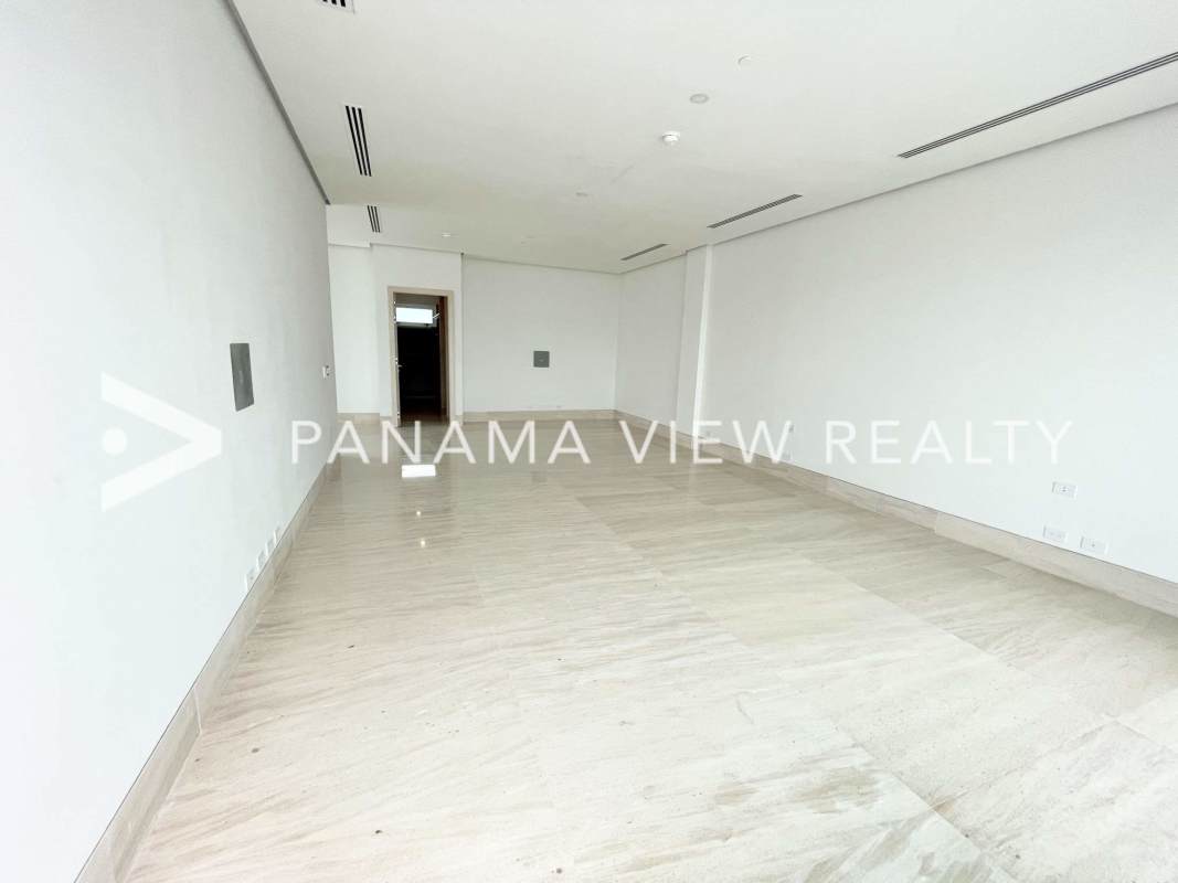 Bright penthouse bedroom floor-to-ceiling windows ocean and marina view Ocean Reef Panama City