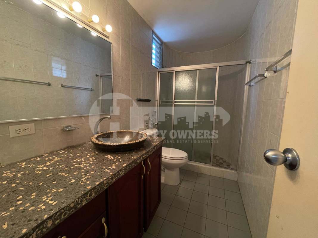 Modern bathroom with granite countertop, vessel sink, glass shower in PH Del Caribe El Cangrejo Panama City