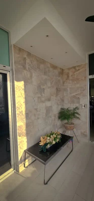 Closed kitchen with granite counters, wood cabinets, stainless appliances in PH San Francisco Bay Panama