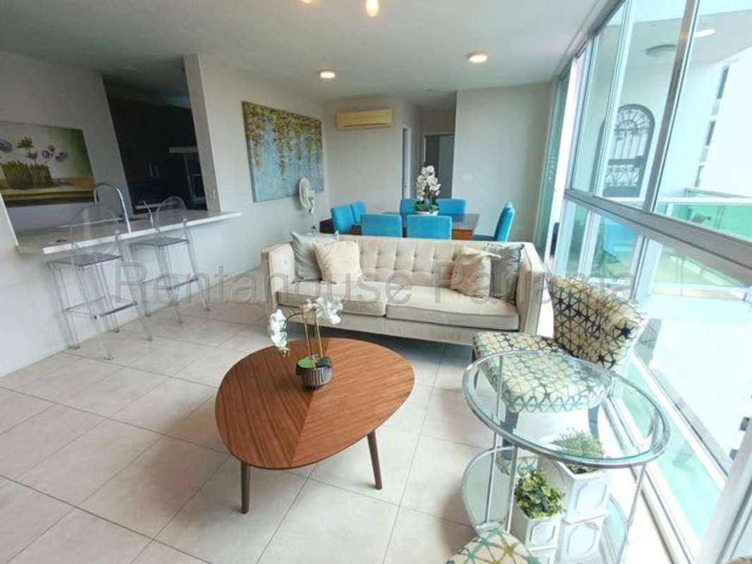 Living room with large windows and city views at PH The Seawaves Bella Vista Panama