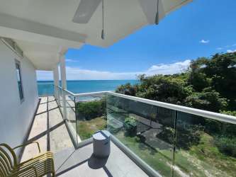Balcony overlooking Pacific Ocean and lush greenery at The Palms El Palmar Panama