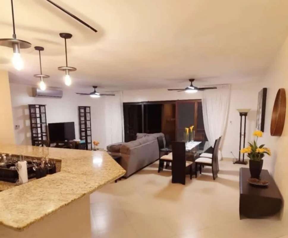 Resort-like swimming pools surrounded by palm trees at PH Embassy Club in Clayton Panama