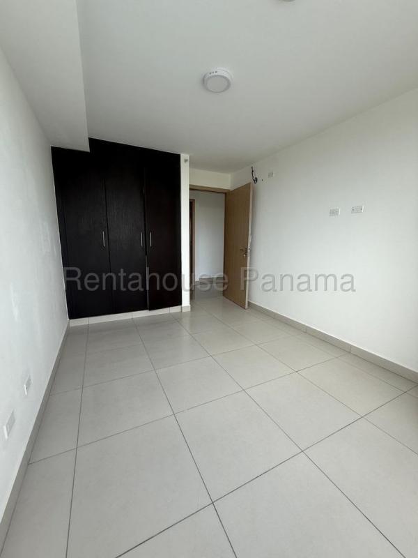 Private balcony overlooking trees and city skyline in PH Tee One San Francisco Panama