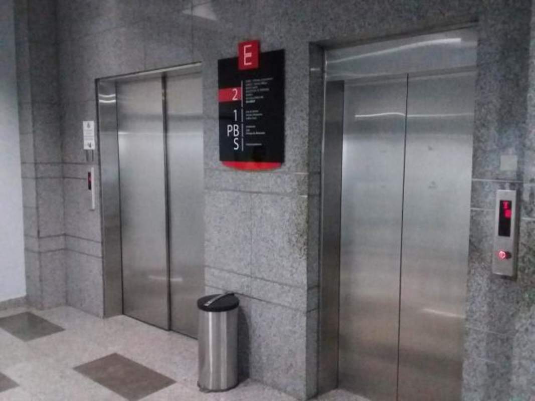 Modern elevator lobby with stainless steel doors and granite walls at PH ELMEC San Francisco