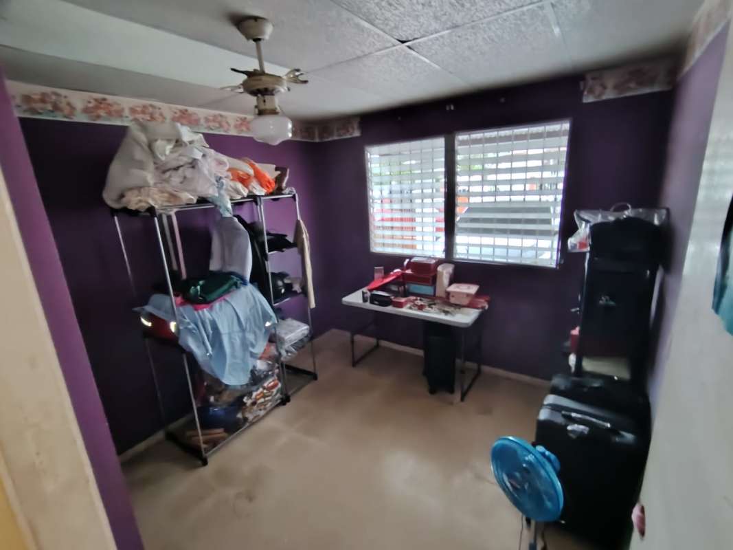 Functional bathroom with tile, shower, and mirror residential home Chanis Panama