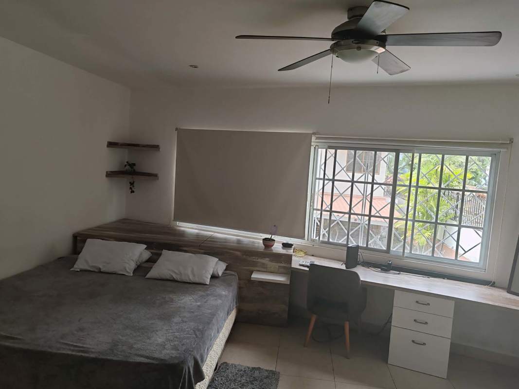 Large master bedroom with bed, closet and natural light in furnished home in Coco del Mar