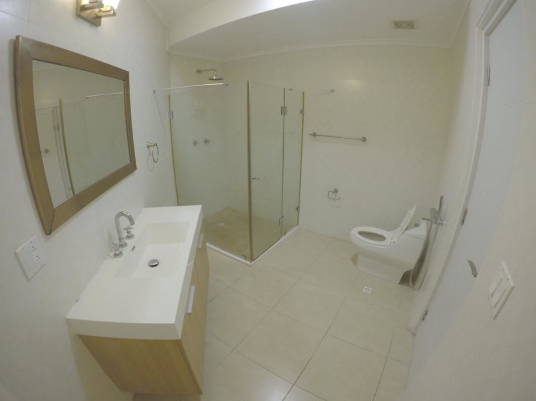 Elegant bathroom with glass shower granite vanity and mirror in Punta Pacifica apartment PH Oasis Panama