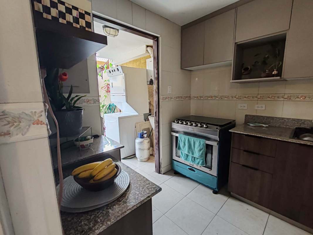 Dining area with tiled floor, modern lighting, access to patio in furnished townhouse Condado del Rey Panama