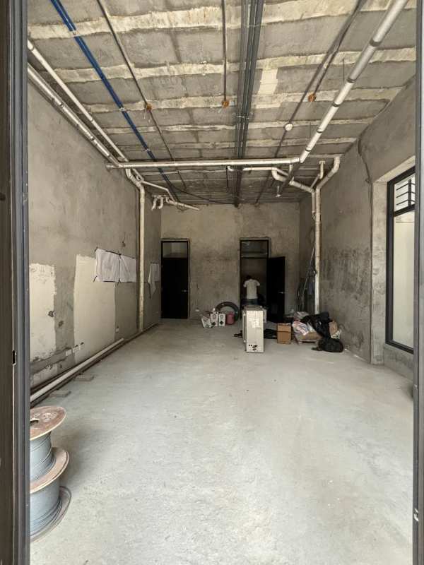 Blank interior commercial unit with concrete floors, exposed pipes at Plazuela de Alfaro Casco Viejo Panama