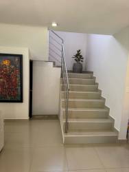 Modern kitchen with tile backsplash, cabinets, refrigerator space in PH Sunset Hills Costa Verde Panama