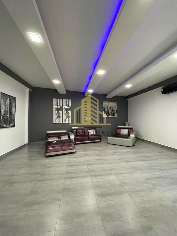 Contemporary living room with gray tiles and blue LED lights Altos de Panamá
