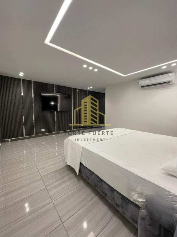 Stylish bathroom with glass shower, modern fixtures in house at Altos de Panamá