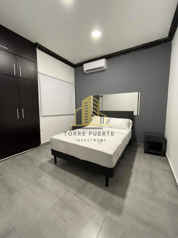 Bedroom with built-in wardrobe and AC unit in spacious house Altos de Panamá