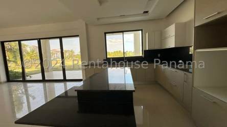 Spacious kitchen with granite island and ocean view windows in Vista Mar beach house San Carlos Panama