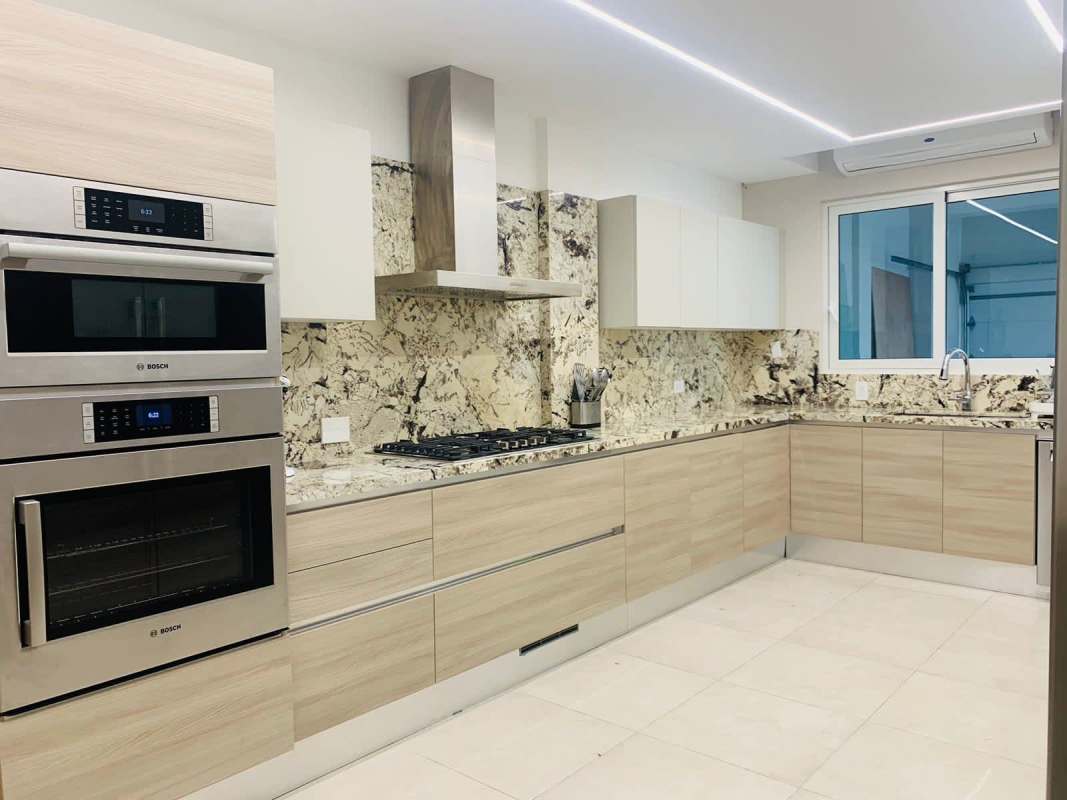 Spacious luxury kitchen with granite countertops, stainless appliances in The Reserve Santa Maria Panama