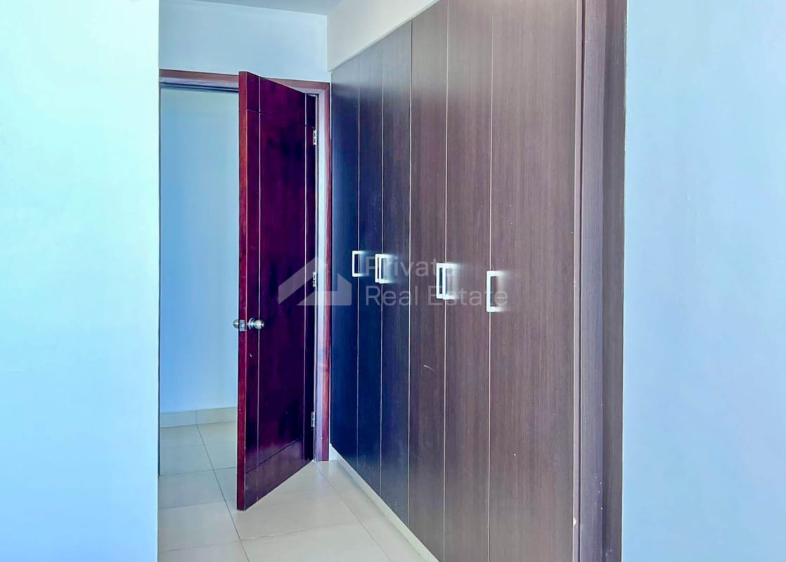 Modern closet area with ample built-in wardrobes PH Oceanaire Punta Pacifica Panama