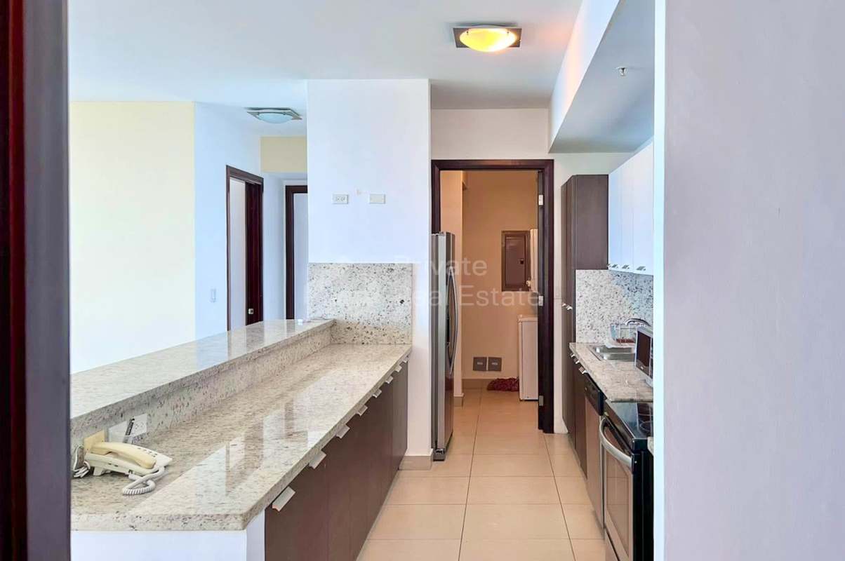 Modern kitchen with granite counters, stainless steel appliances PH Oceanaire Punta Pacifica