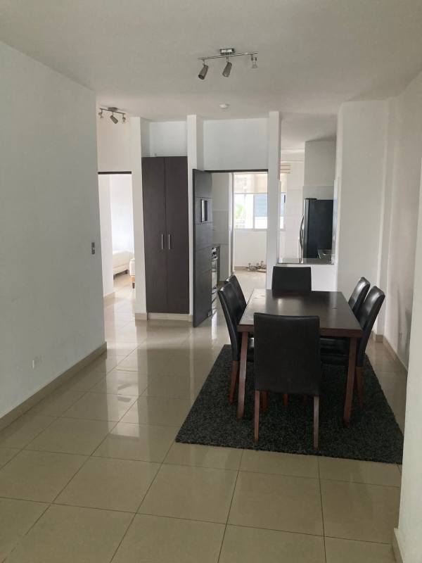 Modern dining space connected to open kitchen area in PH Galería Uno Obarrio Panama