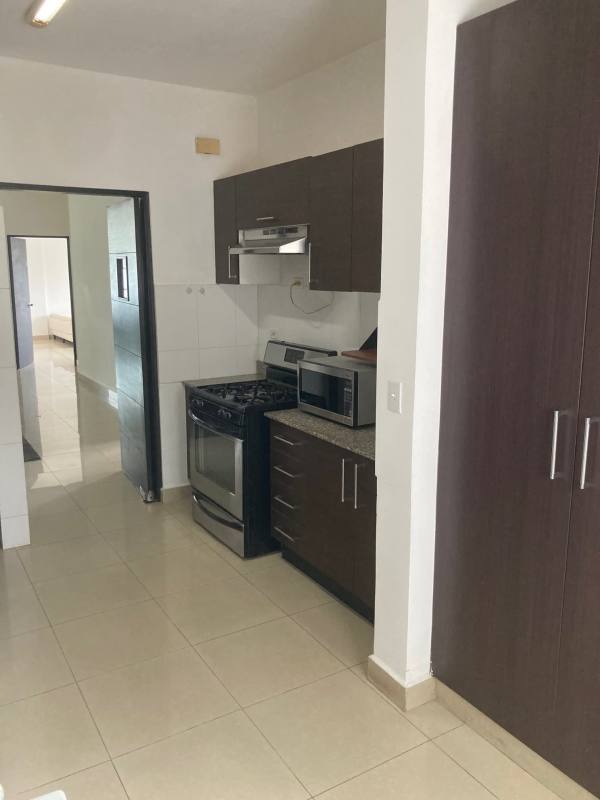 Minimalist bedroom with two twin beds air conditioning tiled floor PH Galeria Uno Obarrio Panama