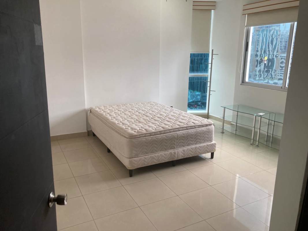 Bedroom with large window tiled floor minimal decor Obarrio Panama for sale PH Galeria Uno