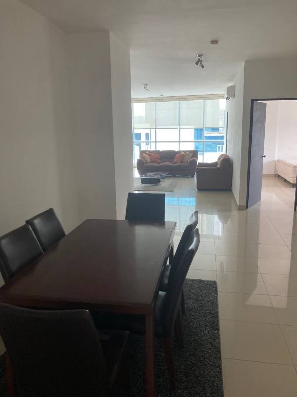 Spacious living room with large windows and ceramic floors in PH Galería Uno Obarrio Panama