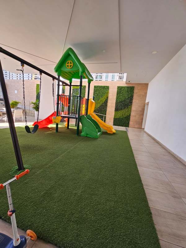 Contemporary kitchen with quartz countertops and stainless steel appliances in luxury Apt at PH BICSA Tower