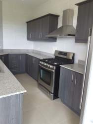 Sleek new kitchen with granite counters stainless appliances ocean view condo Panama