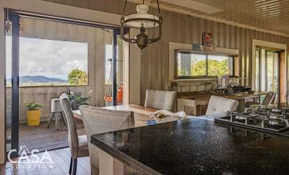 Open concept living space with natural light bamboo floors mountain views Boquete