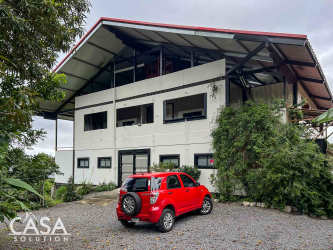 Spacious rustic modern kitchen with island, wood cabinetry, granite top in Boquete Panama