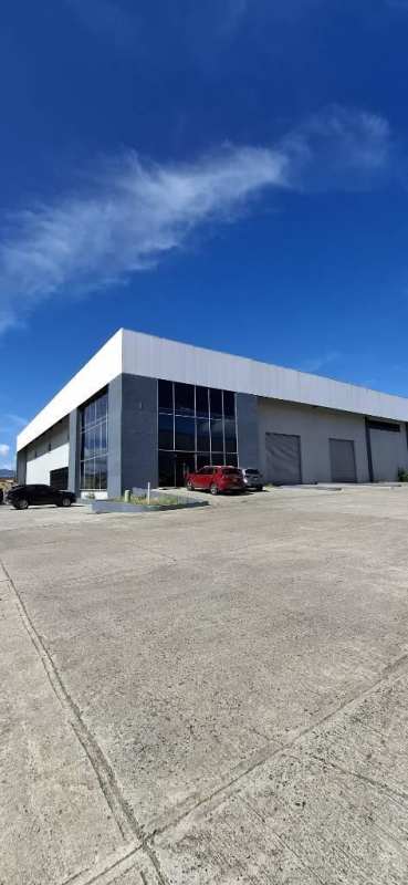 Modern industrial complex exterior with loading bays and parking in Pacora Panama