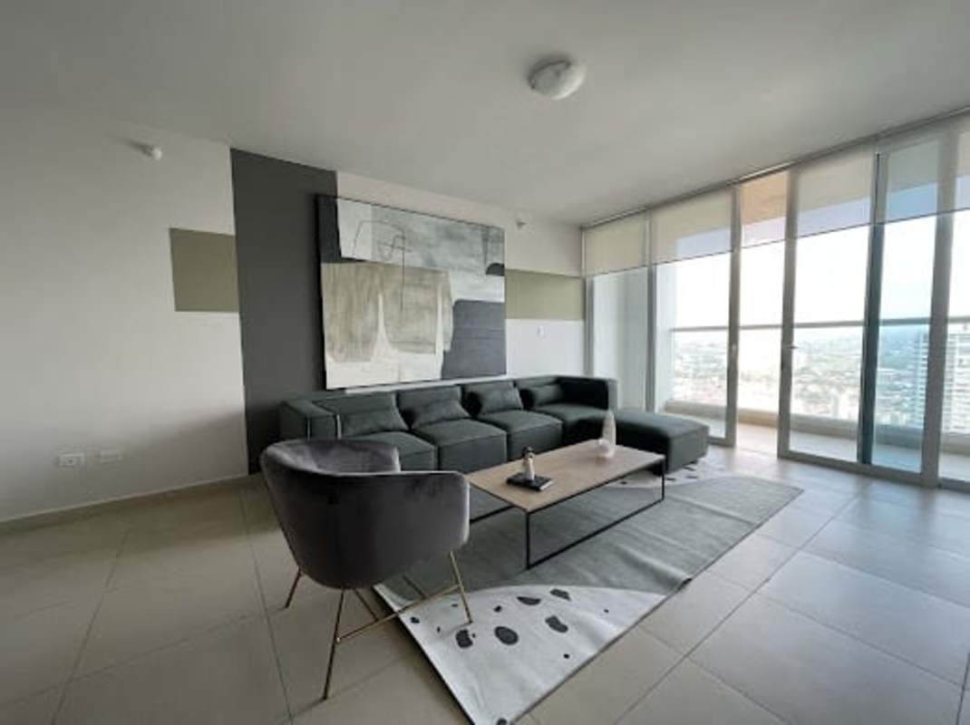 Modern open plan living and dining room with city views in Costa del Este apartment rental