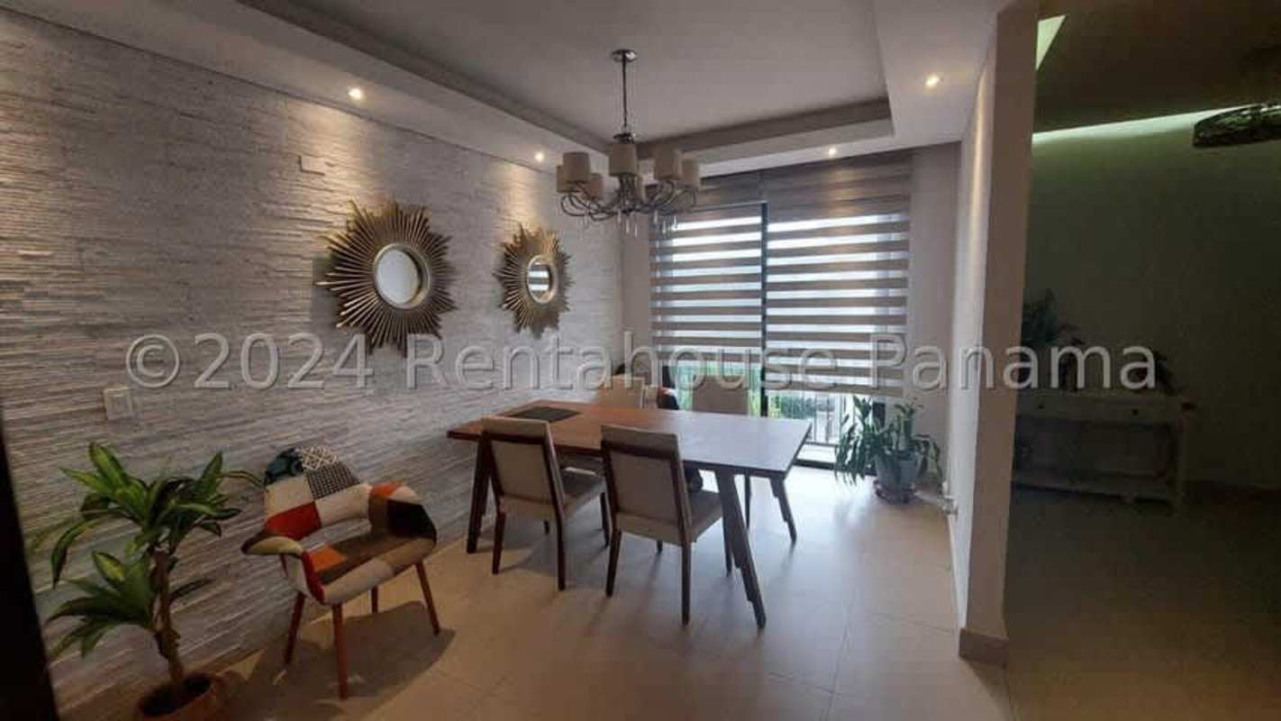 Wide balcony with seating area overlooking greenery in Embassy Village Albrook Panama