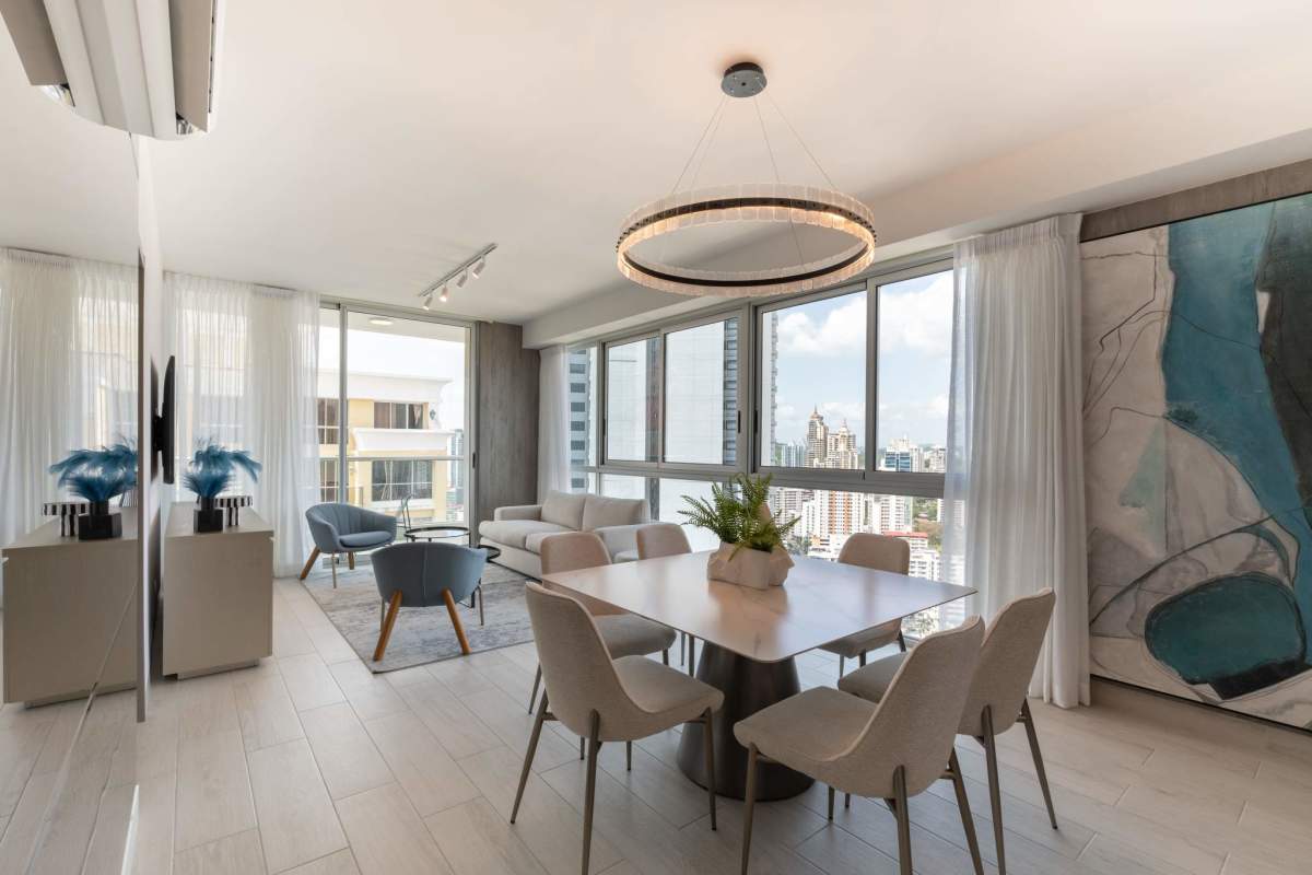 Open plan living and dining room with panoramic skyline views PH Urbana Obarrio Panama