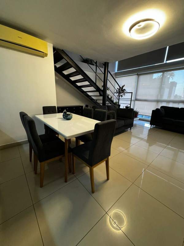 Bright double height living dining area windows PH Vitro Loft El Cangrejo Panama