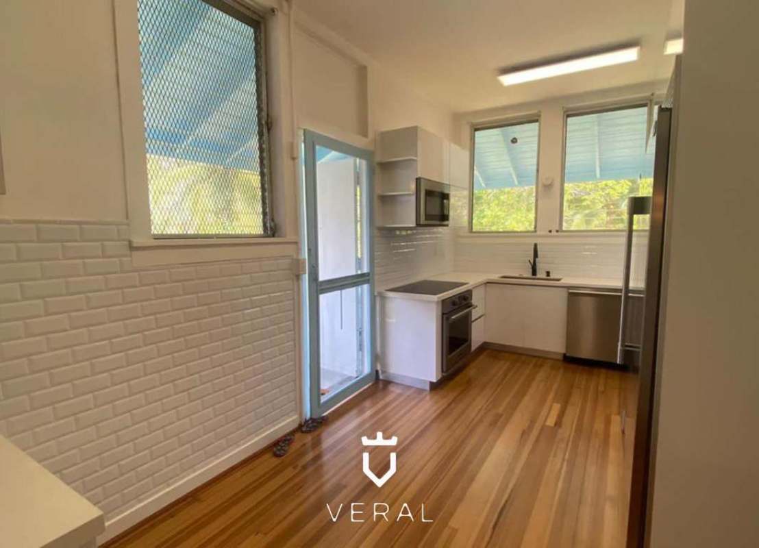 Large covered patio terrace overlooking spacious garden with fruit trees in Ancón Panama