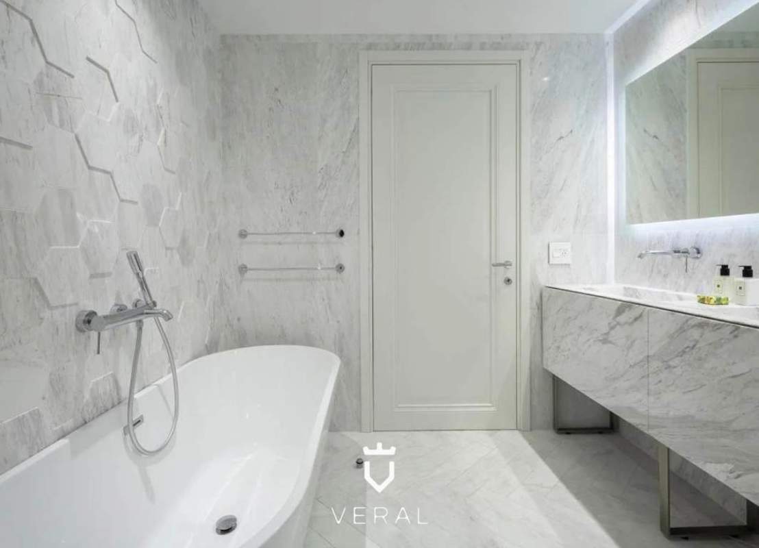 Contemporary living room with large windows and skyline view at PH Wanders & Yoo Panama City