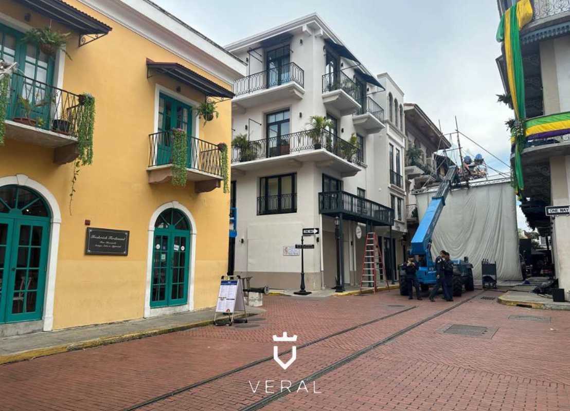 Commercial historic building on cobblestone street with balconies Casco Viejo Panama