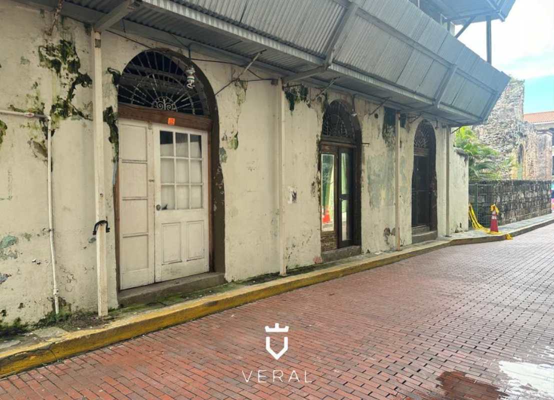 Dilapidated colonial storefront with arches in Casco Viejo Panama
