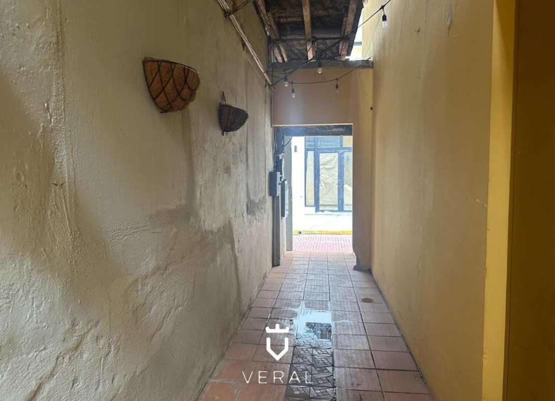 Historic colonial multi-story with arches balconies cobblestone Casco Viejo Panama