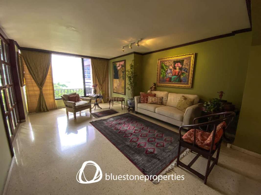 Living room with marble floors, large windows, city views, traditional design PH Marbella Park Panama