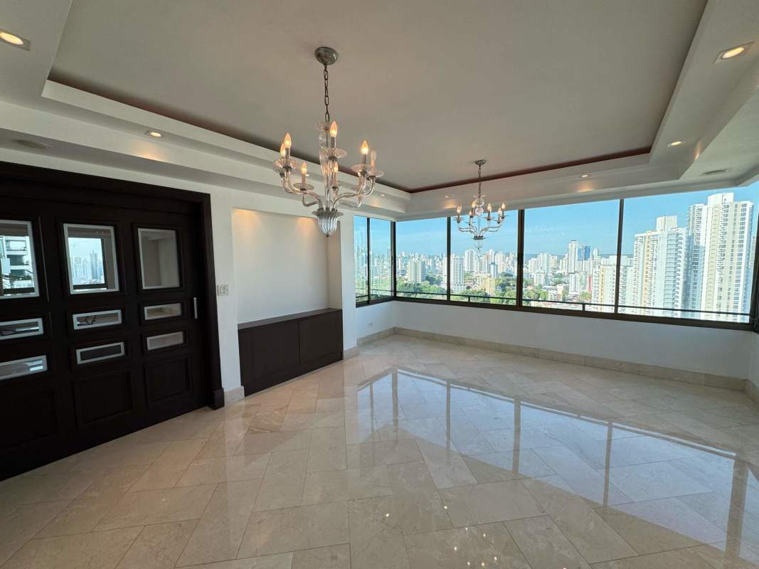 Large Living room floor-to-ceiling windows and skyline view PH Golf Tower Altos del Golf Panama