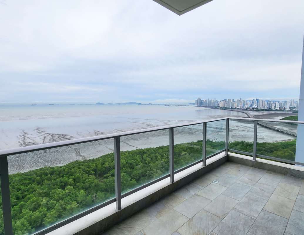 Modern dining and living room open-plan design with marble flooring and large ocean view windows in PH Mirador Costa del Este