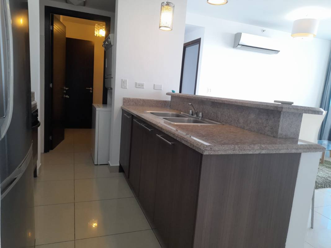 Contemporary furnished lobby with glass walls and modern seating in PH Top Tower Costa del Este Panama