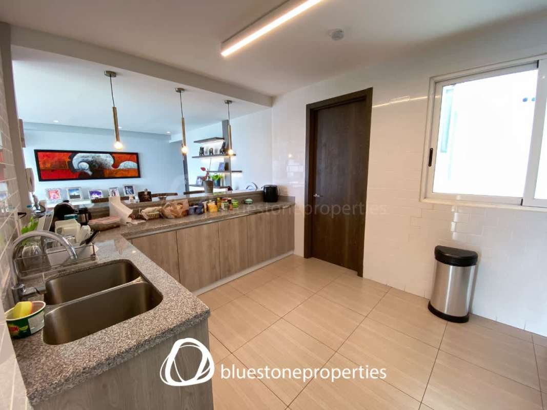 Bright modern living and dining with panoramic windows ocean view PH Costa del Mar Costa del Este Panama