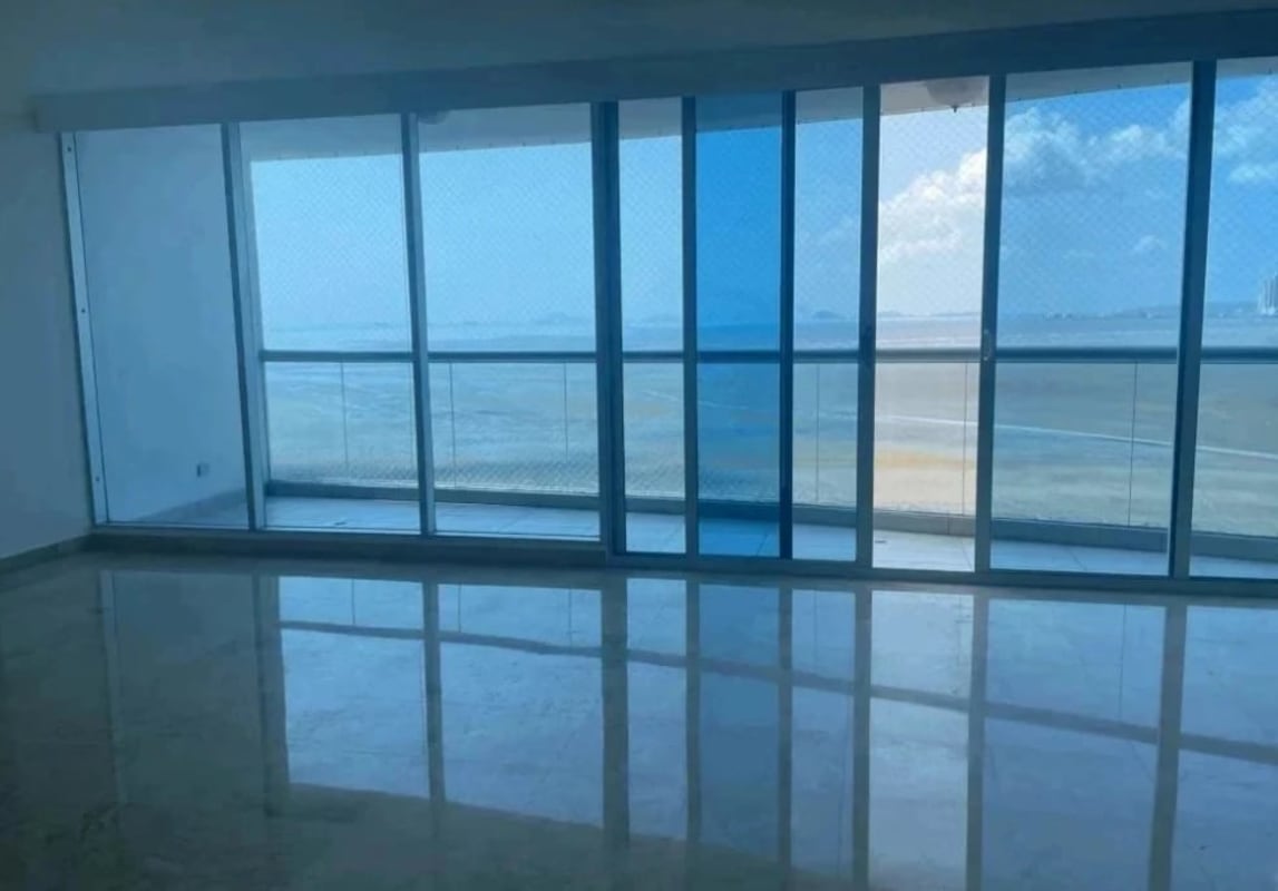 Infinity pool area with sun decking overlooking city skyline at PH Pearl at the Sea Costa del Este Panama