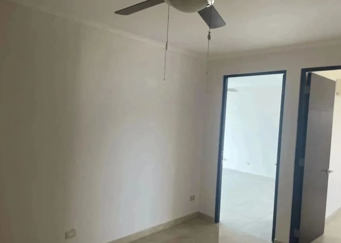 Master bedroom with panoramic window, marble floor and ocean views at PH Pearl at the Sea Costa del Este Panama