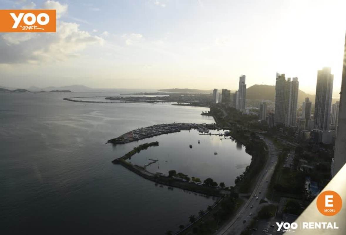 Spacious living room with balcony access and ocean view in PH Yoo Panama fully furnished rental apartment