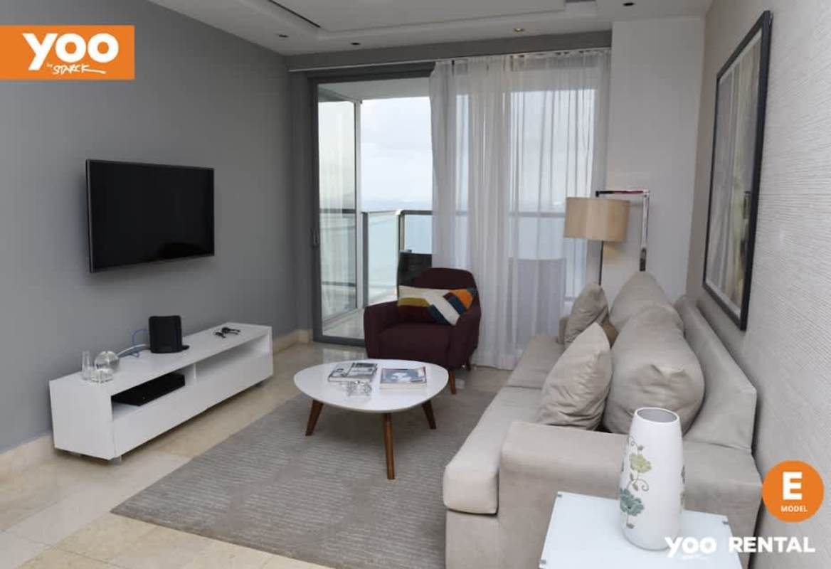 Dining area with large windows overlooking Pacific Ocean in PH Yoo Panama rental apartment