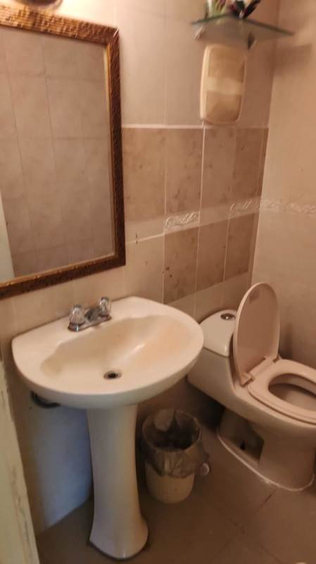 Half bathroom with pedestal sink and mirror PH Crystal Springs Panama