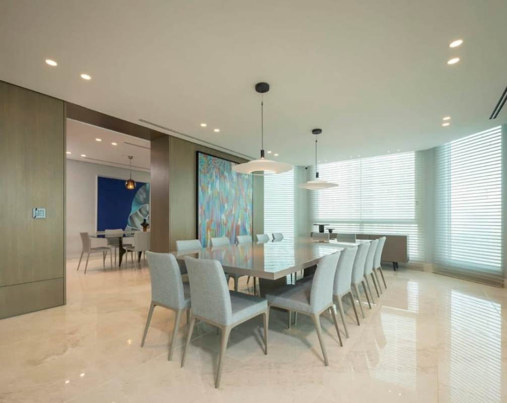 Elegant dining room with marble floor, panoramic windows, and modern lighting in PH Pacific Point